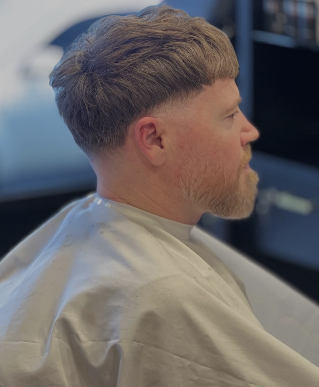 Textured crop with a low taper fade and shaped beard at Golden Fadz Gosford